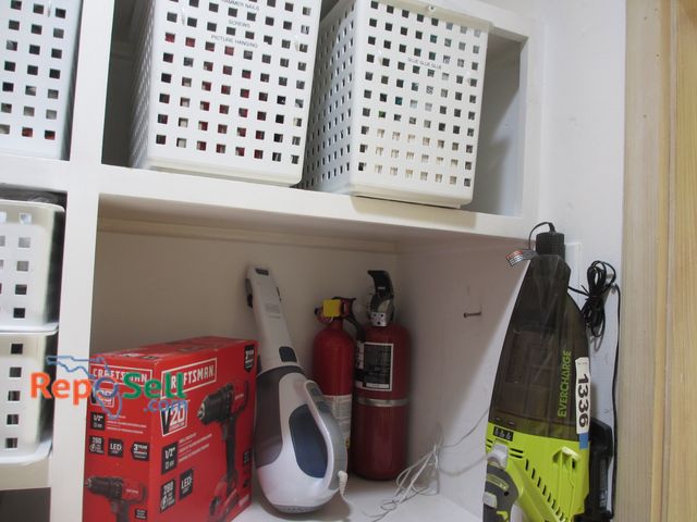 Lot 31-1337 - Contents of Right Side Shelves: Craftsman 20V Drill, Black &amp; Decker Handvac, Misc Tools, Kleenex...