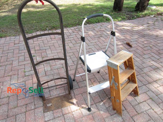 Lot 31-9204 - Three items: a metal hand truck with rubber wheels, an aluminum step stool with two steps and non-sl...