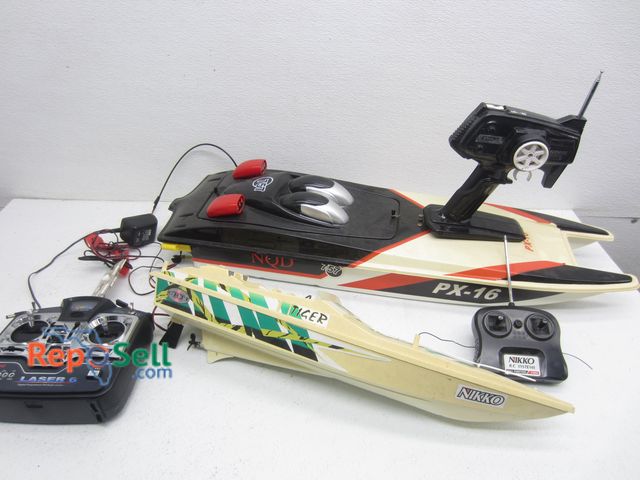 Lot 31-9180 - (2) RC Boats With Remotes: NQD PX-16, Nikko Tiger And Laser RC Remote