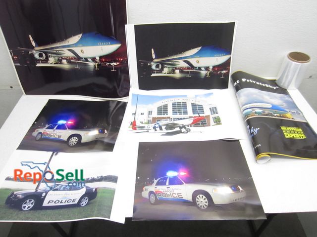 Lot 31-1268 - (16) Posters and Prints of Airplanes, Port Authority, Police Cars, Air Force One. Largest 24 by 18, ...