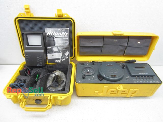 Lot 31-1084 - Atlantis Underwater Camera and Jeep Radio/CD player - untested