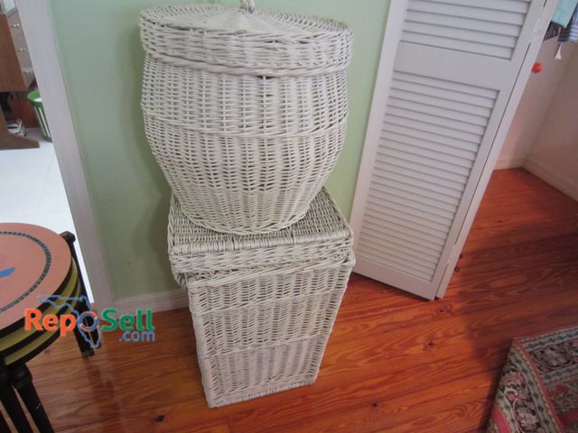Lot 31-9041 - Two White Wicker Hampers With Lids, Featuring Different Shapes And Sizes.