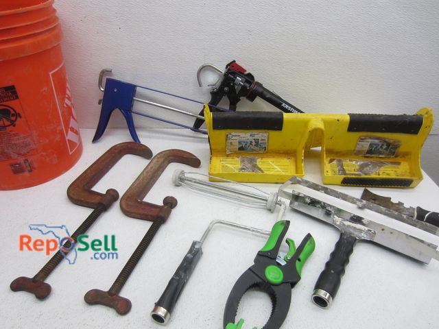 Lot 31-4066 - Bucket of Hand-Tools: (2) 7" Cincinnati Clamps, Ladder Stabilizer, Caulk Guns, etc.