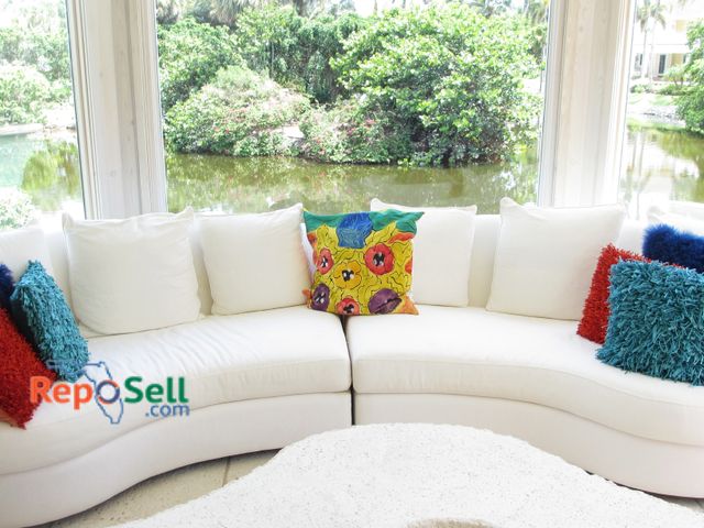 Lot 31-1046 - Cream Fabric Curved Couch w/ (6) Pillows - (2) Pieces, 144"