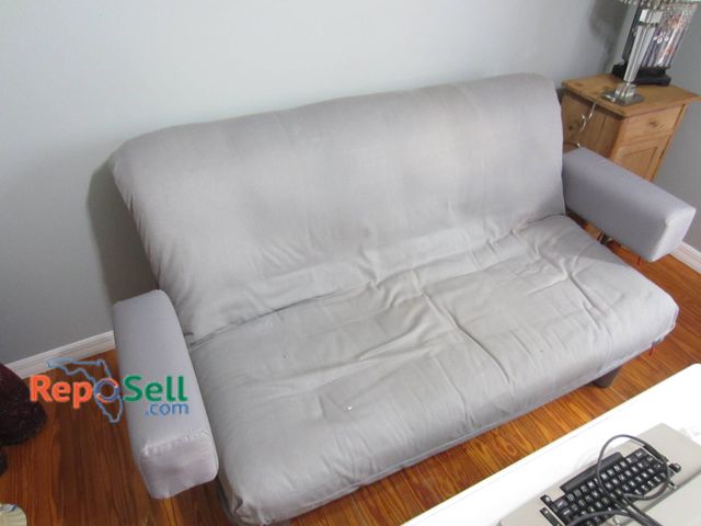 Lot 31-9018 - Gray Upholstered Futon Sofa By Innovation, Convertible, Metal Frame, Adjustable Mechanism.