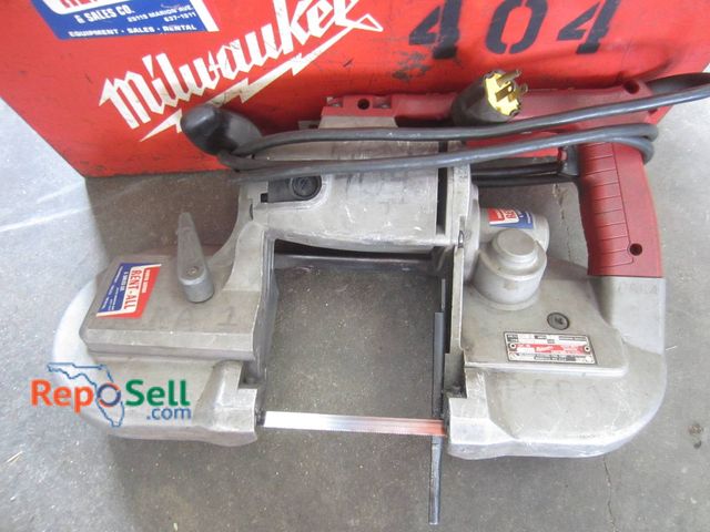 Lot 31-1361 - Milwaukee Heavy-Duty 4 3/4-Inch Deep Cut Band Saw Model 404. Includes Red Metal Tool Case. Powered O...