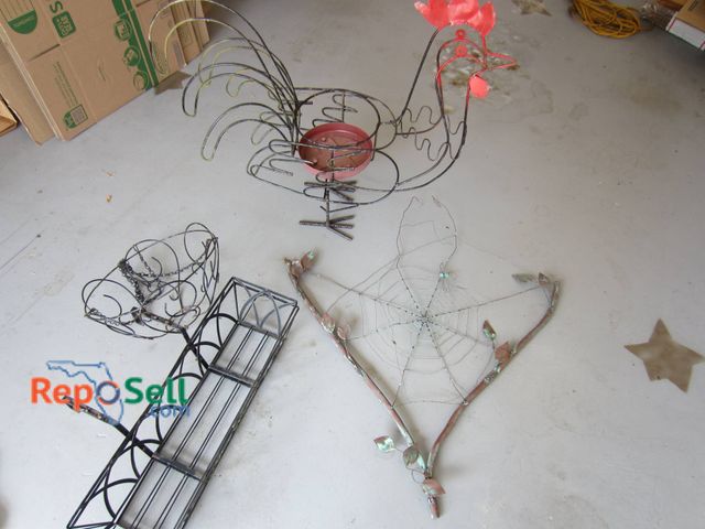 Lot 31-9212 - Metal garden decorations, including a wire rooster sculpture with red painted accents, a wire spider...