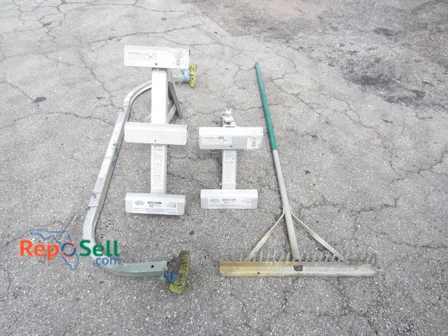 Lot 31-7491 - (2) Ladder Jacks, (1) Ladder Stabilizer &amp; (1) Concrete Rake