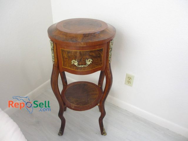 Lot 31-8506 - French-Style Round Walnut Side Table With Drawer And Brass Ormolu 30 inches high by 16 inches