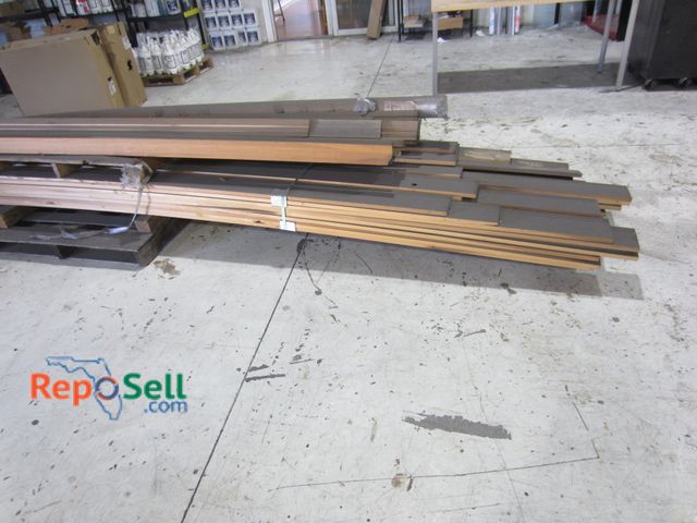 Lot 31-8311 - Large lot of wood trim and casing Largest piece is 16ft Long. All appear to be solid wood.