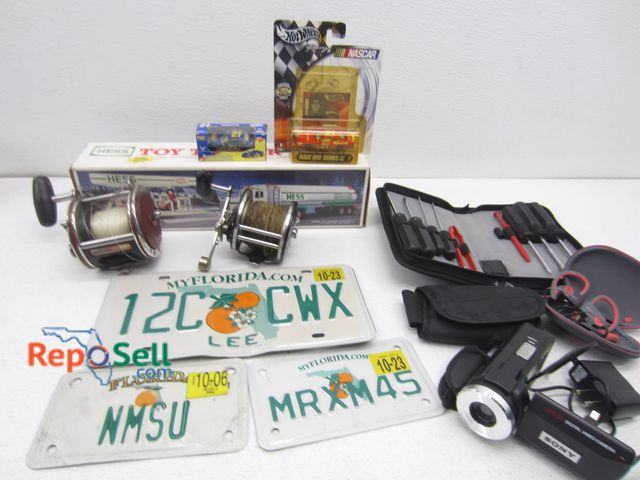Lot 31-9499 - Estate Lot: (2) Penn Reels, Hess Truck, Power Beats Earbuds etc