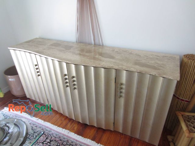 Lot 31-9113 - Curved Metal Credenza With Marble Top, Shelving, And Drawers. Measures 79x23x35 Inches. Marble Top D...