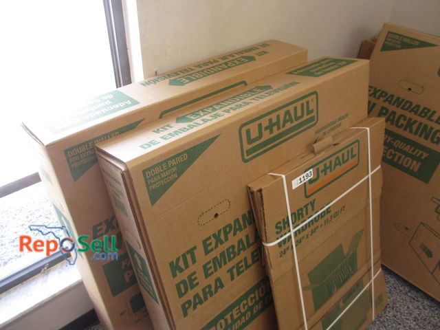 Lot 31-1193 - New Uhaul Moving Boxes Including A Large TV Box Up To 70 Inches And A Short Wardrobe Box 24x34 Inche...
