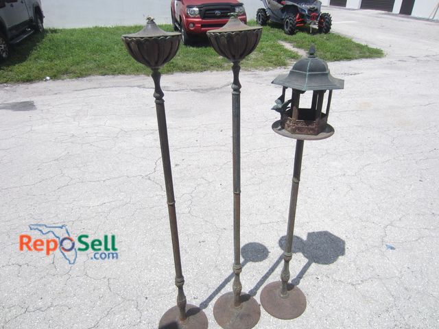 Lot 31-3306 - (2) Cast Iron Torches &amp; (1) Bird Feeder