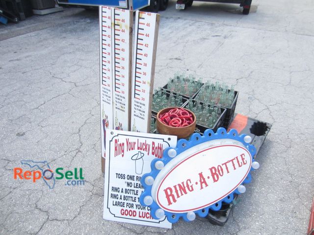 Lot 31-9092 - (Approx 120) Glass Bottles w/Rings - Guess Your Height Game