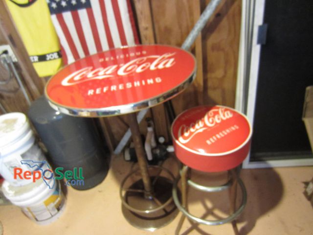 Lot 31-9214 - Coca-Cola themed bar table and stool set featuring a metal construction with red and white Coca-Cola...