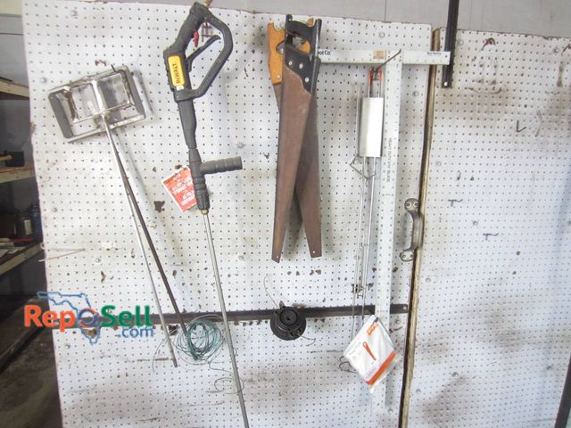 Lot 31-1284 - Tools Including A Hand Saw, Bow Saw, Pressure Washer Wand, String Trimmer Accessories, And A Ruler e...