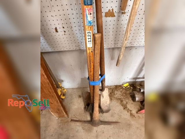 Lot 31-1123 - Roofing Shovels, Pick Axe, And Shovel. Made Of Metal And Wood Materials With Wear Consistent With Us...