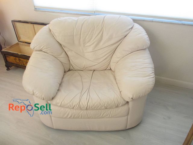 Lot 31-8503 - Beige Leather Club Chair With Plush Cushions, width 48 inches and seat depth 22Gently Used