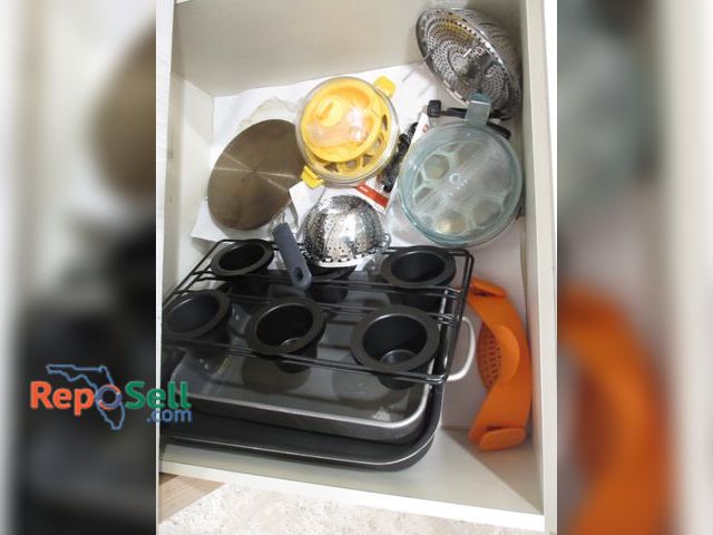Lot 31-1174 - Contents Of Drawer: Denmark Flat Pan, (2) Egg Cookers, Roasting Pans etc