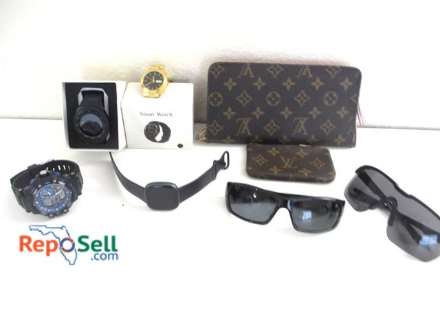 Lot 31-8551 - Accessories Include Wallets, Smartwatches, Sunglasses