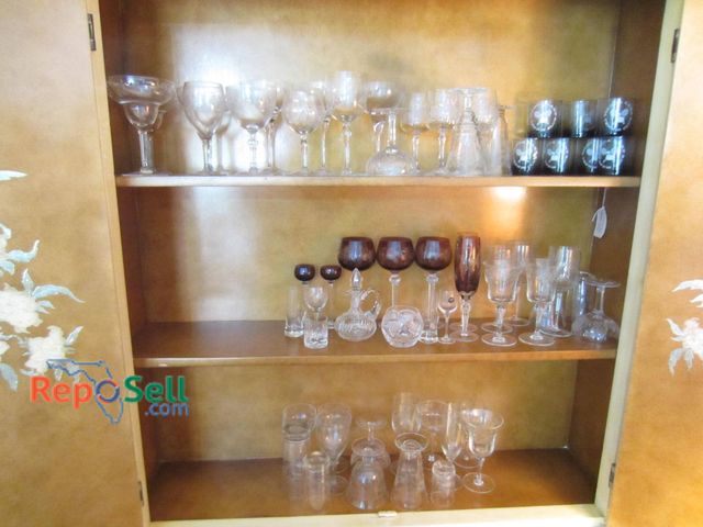 Lot 31-9237 - Glassware including wine glasses, highball glasses, stemware, decanters, and small tumblers. Feature...