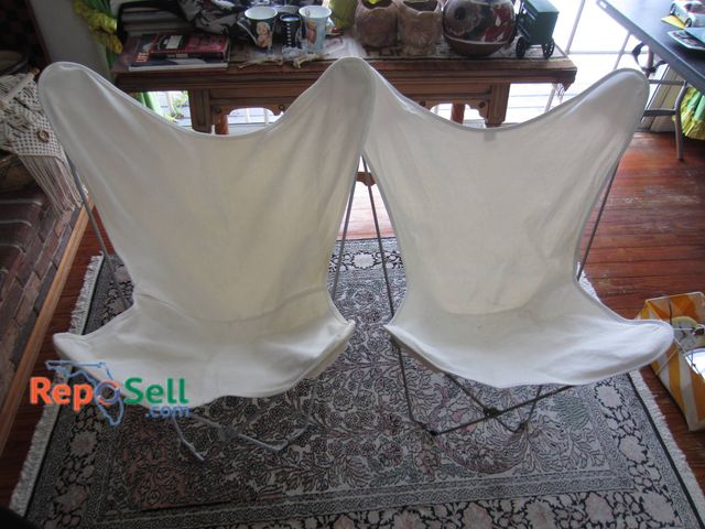 Lot 31-9104 - Metal Butterfly Chair Frames With White Canvas Covers In Used Condition.