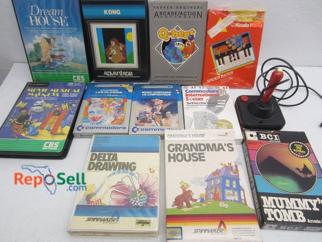 Lot 31-8551 - (10) Vintage Commodore 64 Games And Joystick: Kong, QBert, Mummy Tomb etc - Bring Tote