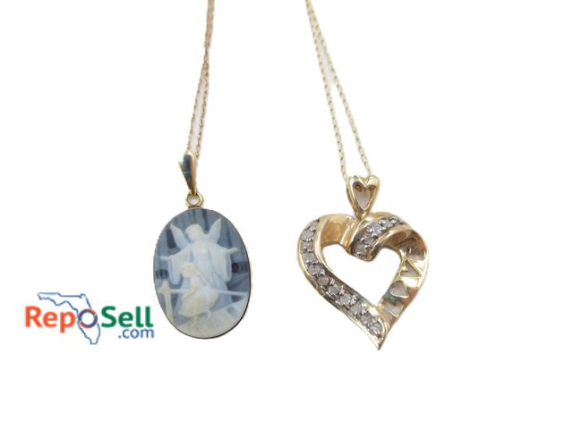 Lot 31-2038 - Jewelry Lot: 10K Diamond Heart Pendant (approx 2.1ct total), 14K Gold Rimmed Religious Pendant (appr...