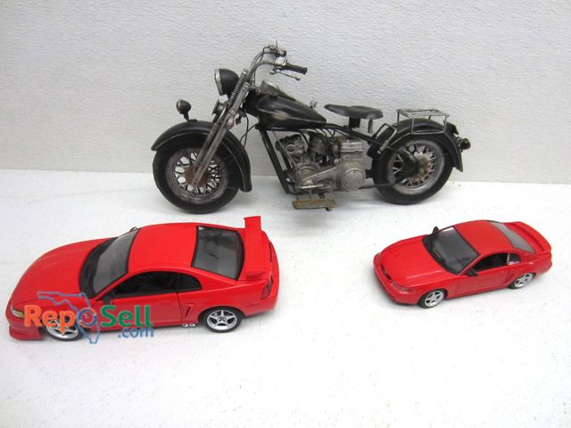 Lot 31-9163 - Metal Motorcycle Decor And (2) Mustang Cars