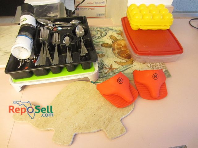 Lot 31-8563 - Kitchen Lot: Silverware, Egg Holder, Cutting Boards, Storage Containers