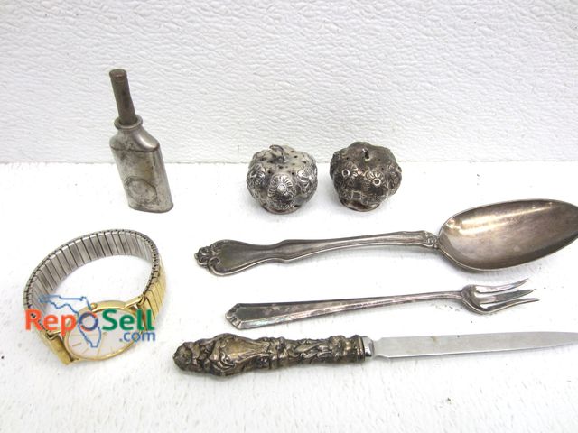 Lot 31-1405 - 4.6oz Silver: Salt Pepper Shaker, Spoon and Fork. Includes Watch, Silver handle knife.