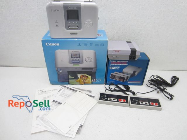 Lot 31-5451 - Canon Selphy CP710 Photo Printer And Mini Nintendo With (620) Built In Games - Both Power On