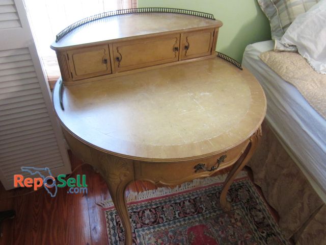 Lot 31-9031 - Vintage Wood Desk With Decorated Upper Drawers, Curved Details, And Approx. 36-Inch Width.