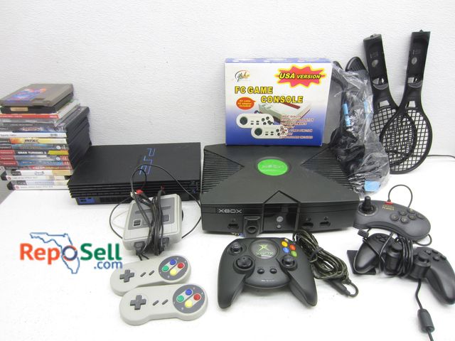 Lot 31-3162 - Lot Of Video Game Consoles, Games And Acces: XBox (Power On), PS2 (Power On), (17) Games, Remotes, W...