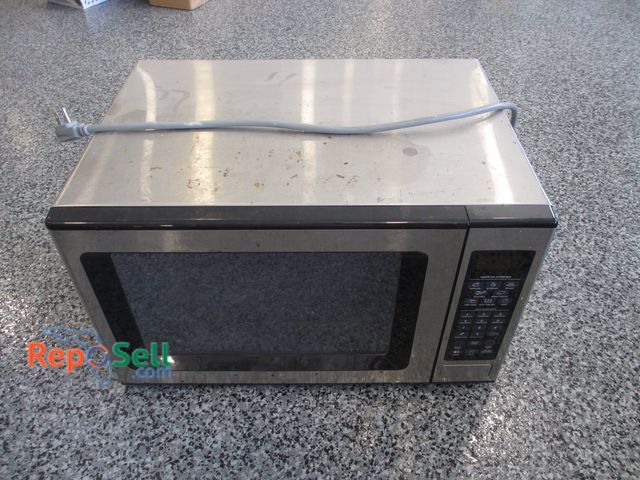 Lot 31-1181 - Stainless Steel Microwave Featuring Digital Control Panel And Glass Turntable. Unit Displays Wear In...
