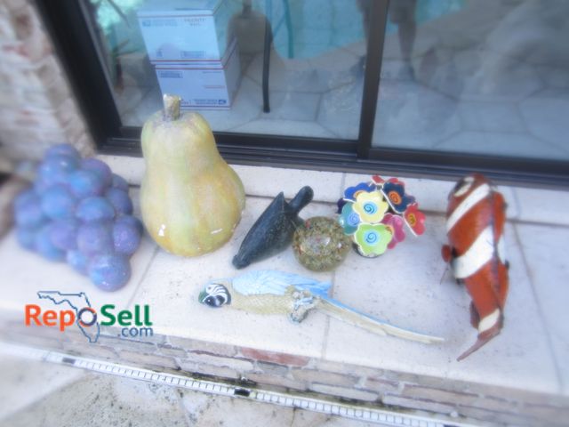 Lot 31-1400 - (7) Pcs of Outdoor Décor: Fish, Fruit, etc.
