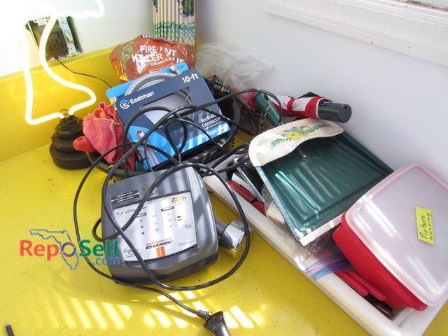 Lot 31-9144 - Household items including a palm tree-shaped neon table light, a Schumacher Speed Charger, a 10-ft E...