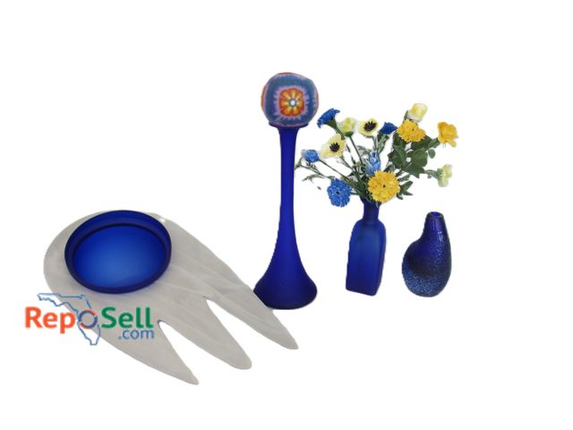 Lot 31-1045 - (4) Vibrant Blue Glass Pieces - 2-Vases w/Ceramic Flowers, 1-Candlestick w/Candle, 1-Bowl