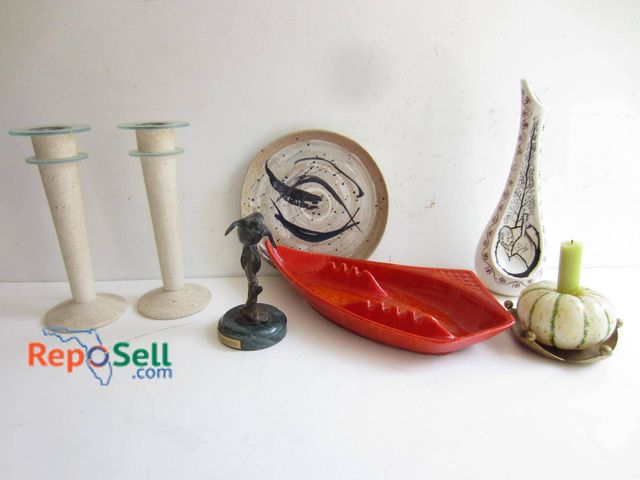 Lot 31-9189 - Lot featuring a variety of decorative items, including two textured candlesticks, a dolphin sculptur...