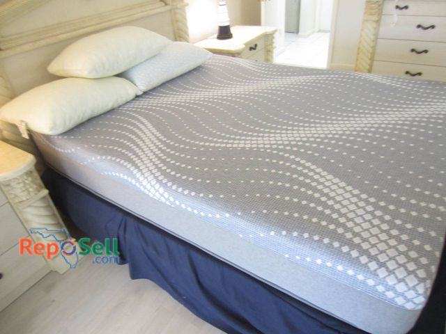 Lot 31-8617 - Queen Size Bed With Carved Wood Frame, Mattress, and Pillows - Bring Labor