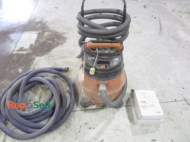 Lot 31-8112 - Ridgid Rolling 16 gal 6.5HP Vac w/Hose &amp; (10) Dust Bags - Poweers On
