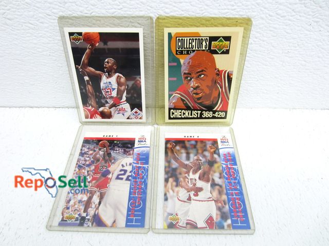 Lot 31-3274 - (4) Michael Jordan Basketball Cards with sleeves