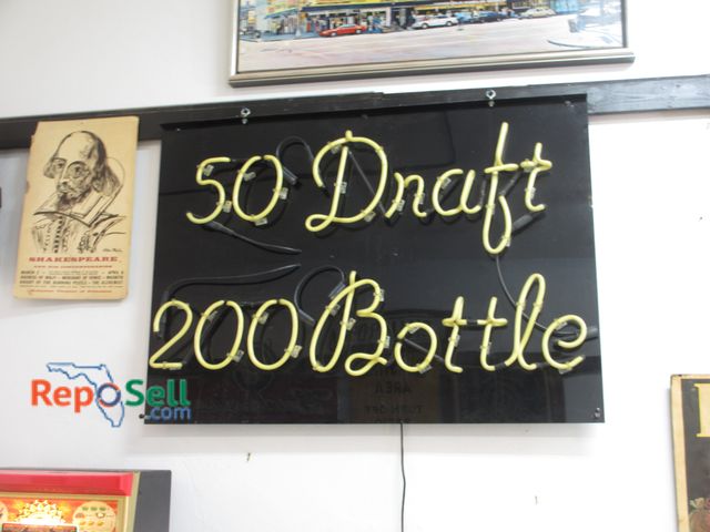 Lot 31-1117 - 50 Draft / 200 Bottle Neon Lighted Sign; 28" x 35"; Powers On; Bring Tools to remove from wall