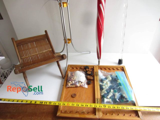 Lot 31-9308 - A folding stool with woven wood seat, a chrome ice bucket with stand, a red and white striped umbrel...