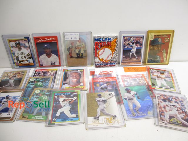 Lot 31-6021 - (19) baseball cards in sleeves: Mookie Wilson, Sosa, McGwire, Ripken, 1953 Wagner, 12-pack Nolan Rya...