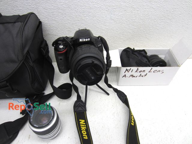 Lot 31-9239 - Nikon D5100 Digital Camera With Bag, (2) Lens, (4) Batteries, etc - Power On