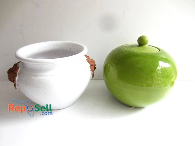 Lot 31-9233 - Ceramic containers, including a white vessel with decorative handles and a green lidded jar. The whi...
