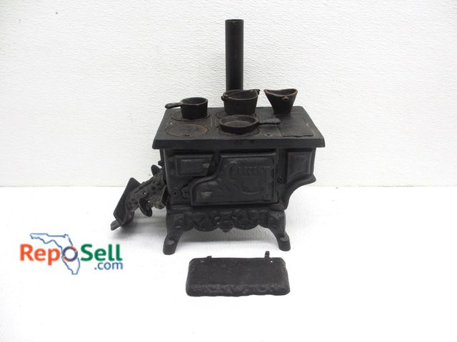 Lot 31-9115 - Small Cast Iron Stove with Cooking Pots