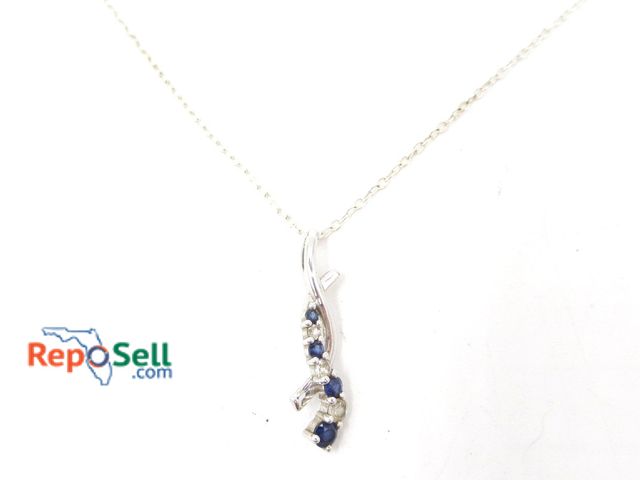 Lot 31-6003 - 10K White Gold Sapphire/Topaz Pendant (.85g) and .925 18" Chain - 1.73g total